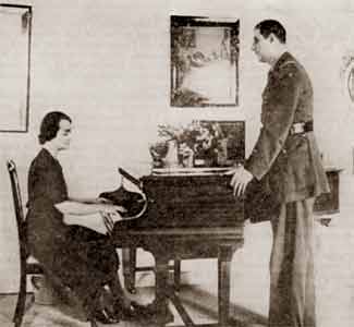The General, in London, looking at Madame de Gaulle playing the piano... The General, in London, looking at Madame de Gaulle playing the piano...
